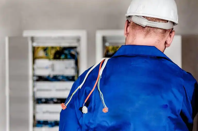 Electrician working on panel