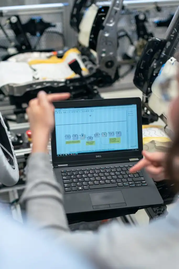 Factory worker using laptop