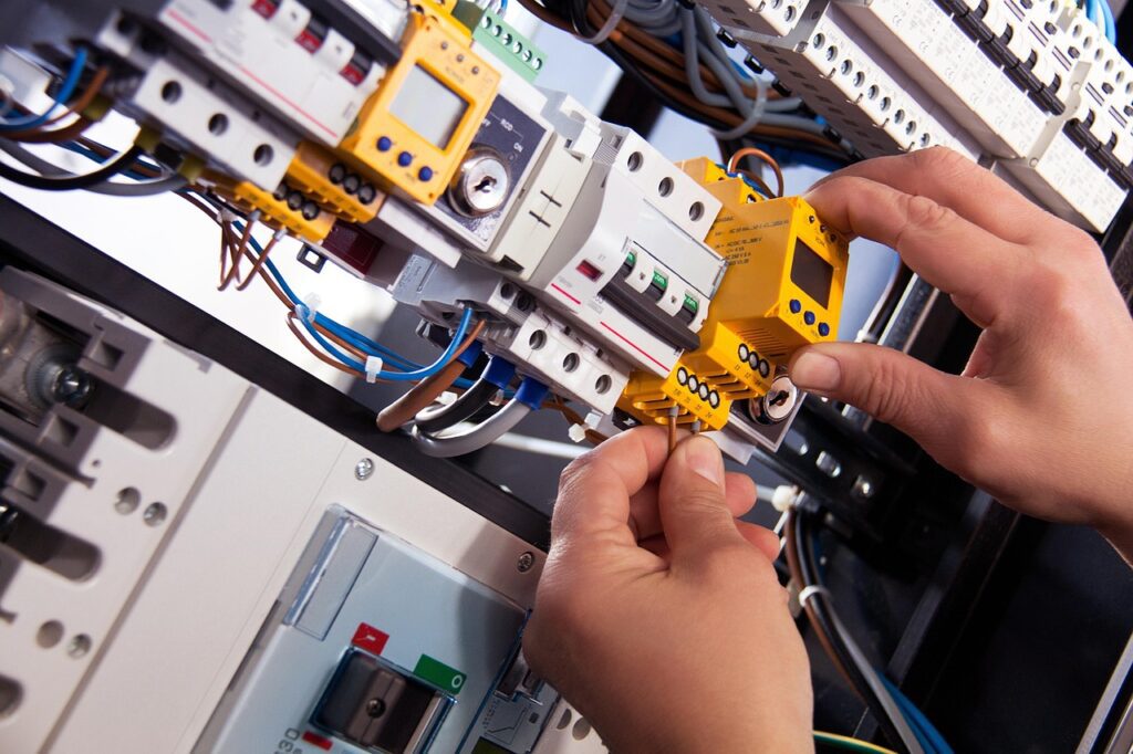 Electrician working on panel