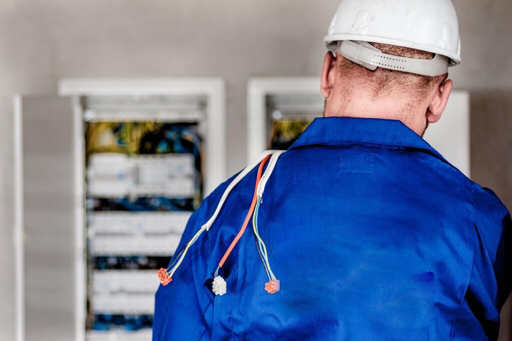 Electrician working on panel