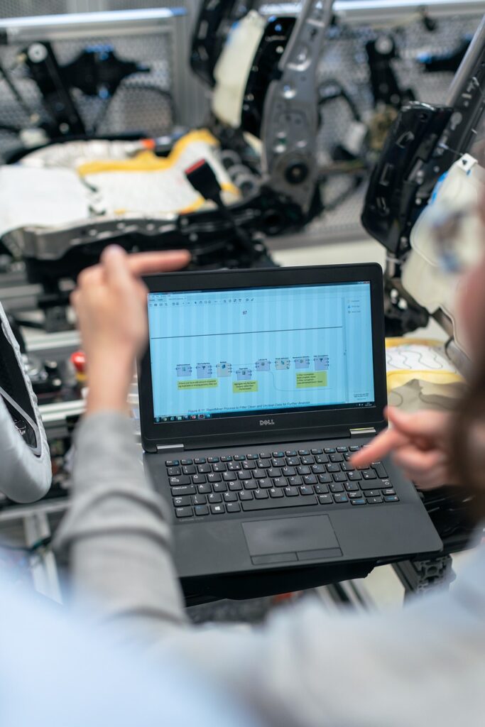 Factory worker using laptop